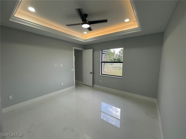 2710 10th St SW, Lehigh Acres, FL 33976 - spare room featuring a raised ceiling, recessed lighting, a ceiling fan, and baseboards