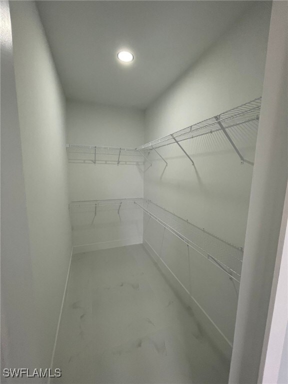 2710 10th St SW, Lehigh Acres, FL 33976 - walk in closet with marble look tiles