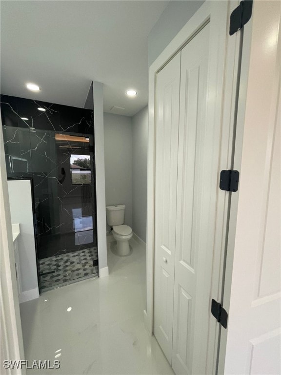 2710 10th St SW, Lehigh Acres, FL 33976 - bathroom featuring toilet, a marble finish shower, recessed lighting, a closet, and baseboards