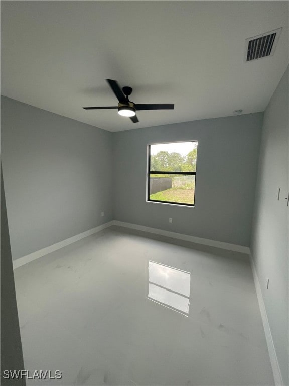 2710 10th St SW, Lehigh Acres, FL 33976 - spare room with baseboards and a ceiling fan