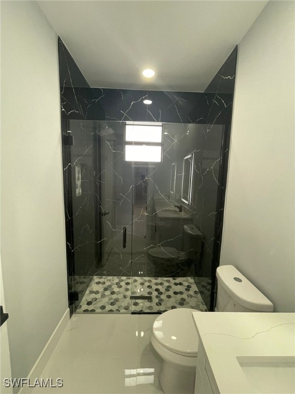 2710 10th St SW, Lehigh Acres, FL 33976 - full bath featuring toilet, a marble finish shower, and vanity