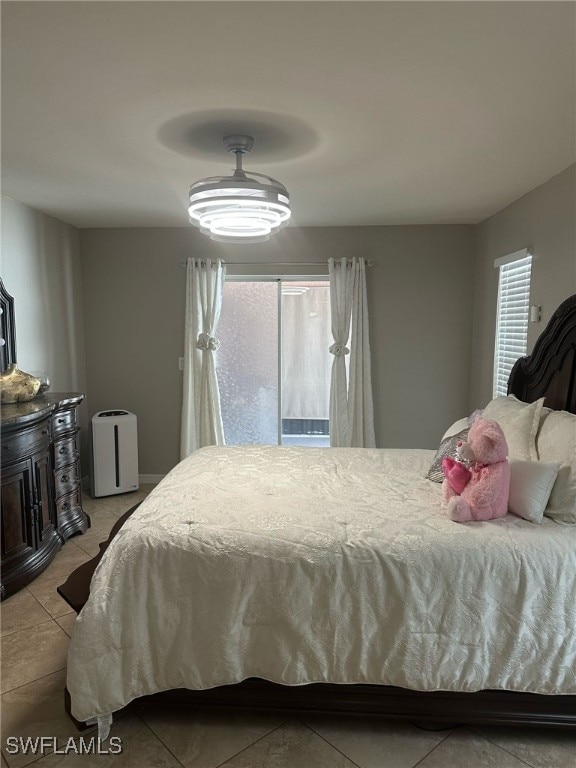 bedroom featuring light tile patterned flooring