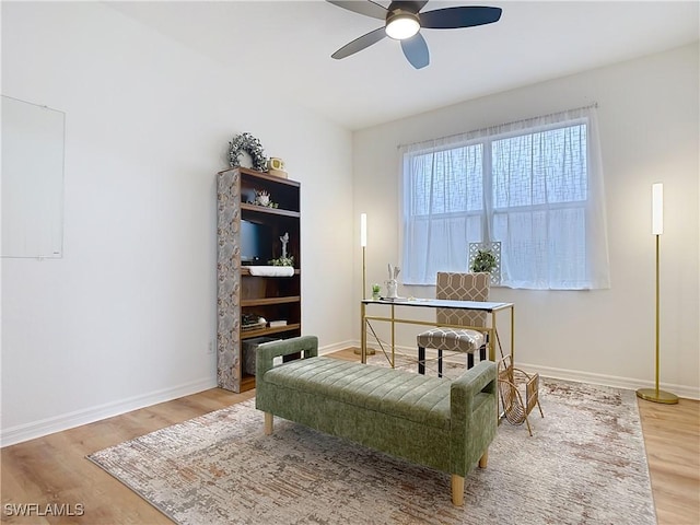 home office featuring baseboards, wood finished floors, and ceiling fan