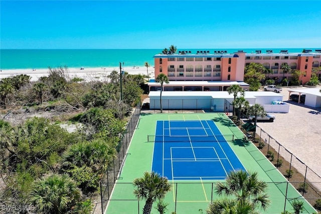 2230 Camino Del Mar Dr Unit 1C4, Sanibel, FL 33957 - view of sport court with fence, a beach view, and a water view