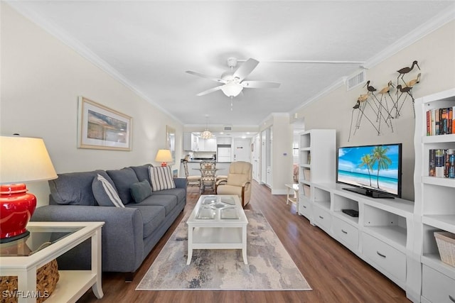 2230 Camino Del Mar Dr Unit 1C4, Sanibel, FL 33957 - living room with dark wood finished floors, a ceiling fan, crown molding, and visible vents