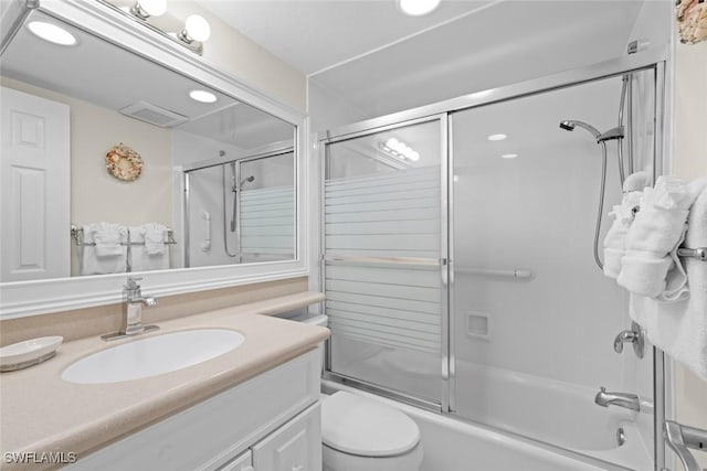 2230 Camino Del Mar Dr Unit 1C4, Sanibel, FL 33957 - bathroom featuring combined bath / shower with glass door, toilet, vanity, and visible vents