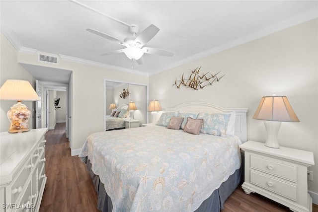 2230 Camino Del Mar Dr Unit 1C4, Sanibel, FL 33957 - bedroom featuring dark wood finished floors, visible vents, a closet, crown molding, and baseboards