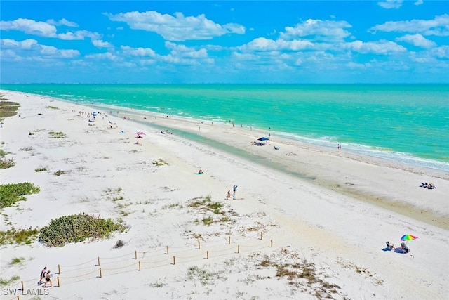 2230 Camino Del Mar Dr Unit 1C4, Sanibel, FL 33957 - property view of water featuring a view of the beach