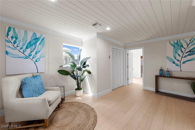 sitting room with wood ceiling, ornamental molding, baseboards, light wood finished floors, and recessed lighting