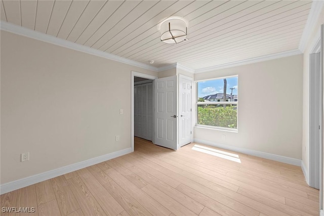 unfurnished bedroom featuring crown molding, baseboards, light wood-style floors, and wooden ceiling