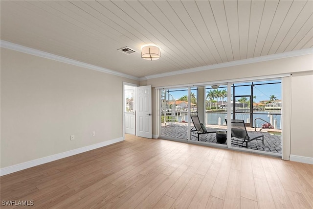 empty room with baseboards, light wood-type flooring, ornamental molding, a water view, and wood ceiling