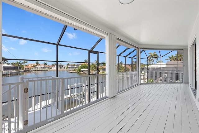 wooden deck featuring a water view