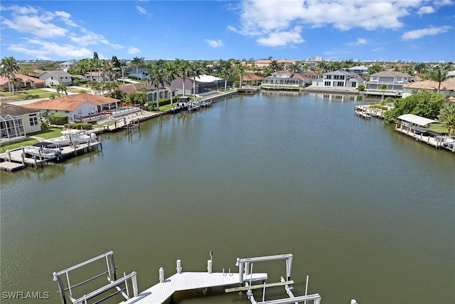 aerial view of residential area featuring a nearby body of water