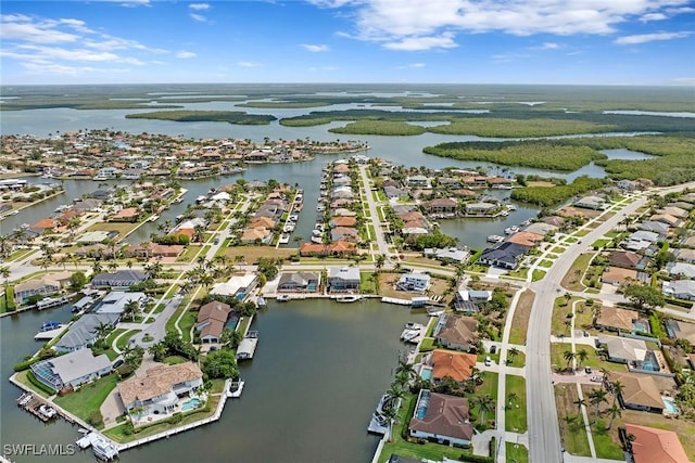 aerial overview of property's location with a large body of water and nearby suburban area