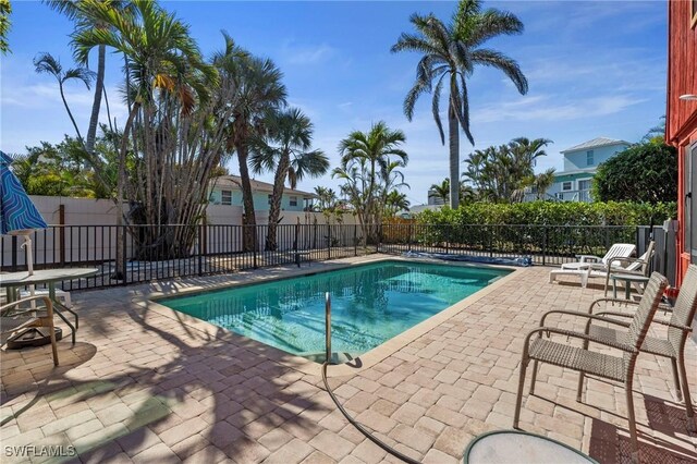 210 Miramar St, Fort Myers Beach, FL 33931 - view of swimming pool featuring fence, a fenced in pool, and a patio area