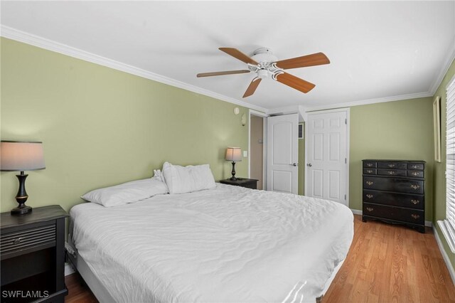 210 Miramar St, Fort Myers Beach, FL 33931 - bedroom with wood finished floors, ceiling fan, and crown molding