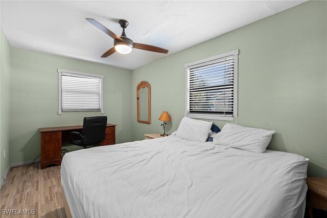 210 Miramar St, Fort Myers Beach, FL 33931 - bedroom with baseboards, ceiling fan, and light wood-style floors