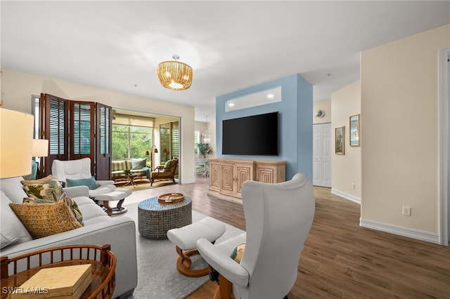 770 Tarpon Cove Dr Unit 702, Naples, FL 34110 - living room with wood finished floors and a chandelier