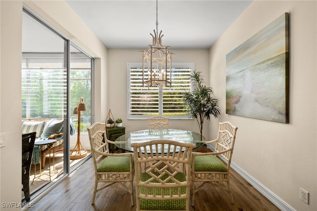 770 Tarpon Cove Dr Unit 702, Naples, FL 34110 - dining space featuring wood finished floors, plenty of natural light, and a chandelier