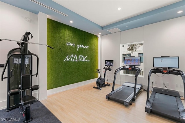 201 8th St S Unit 301, Naples, FL 34102 - exercise room with wood finished floors and recessed lighting