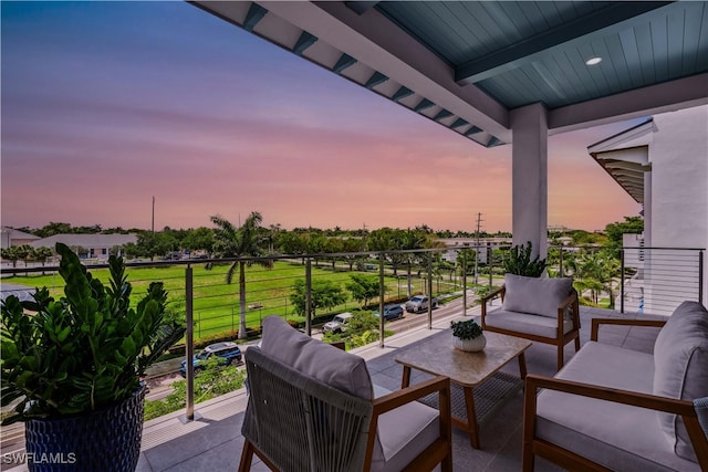 201 8th St S Unit 301, Naples, FL 34102 - balcony at dusk with outdoor lounge area