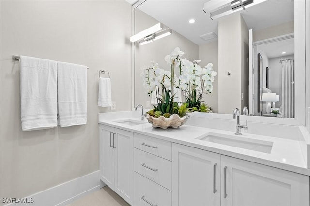 201 8th St S Unit 301, Naples, FL 34102 - bathroom featuring a sink, double vanity, and recessed lighting