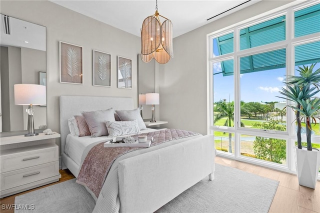 201 8th St S Unit 301, Naples, FL 34102 - bedroom featuring light wood-style flooring