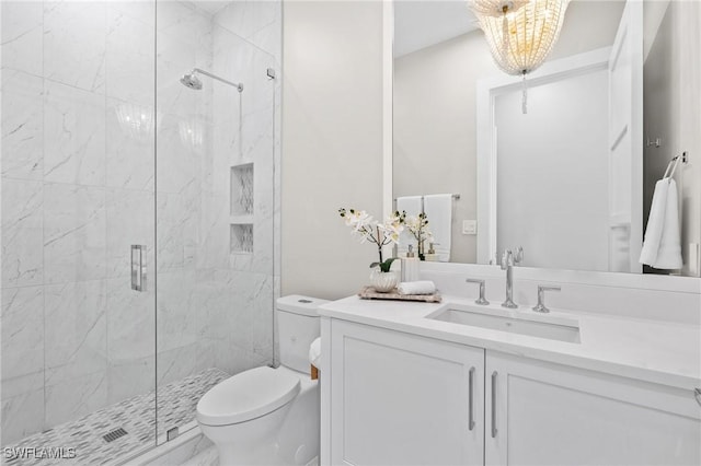 201 8th St S Unit 301, Naples, FL 34102 - full bath with vanity, toilet, and a marble finish shower
