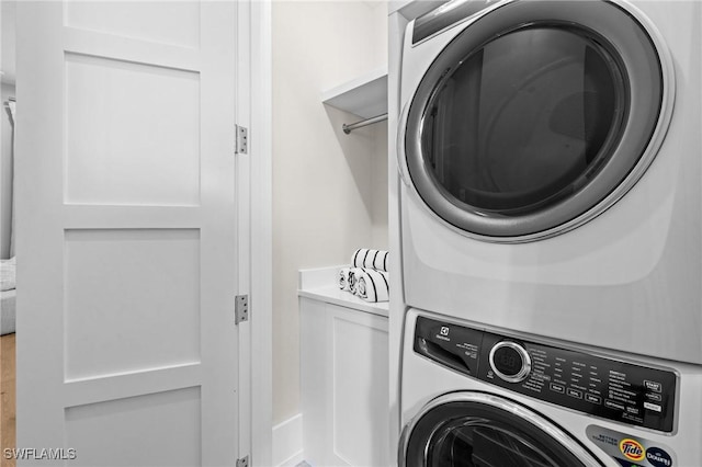 201 8th St S Unit 301, Naples, FL 34102 - washroom featuring laundry area and stacked washer / drying machine