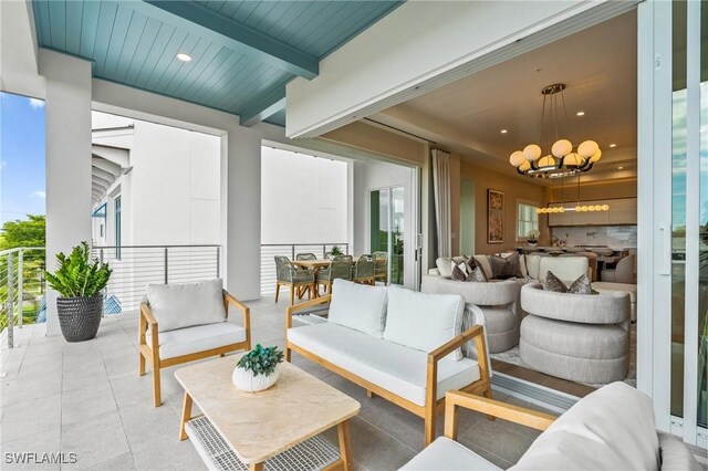 201 8th St S Unit 301, Naples, FL 34102 - exterior space featuring an inviting chandelier, beam ceiling, light tile patterned floors, and recessed lighting