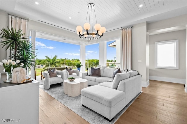 201 8th St S Unit 301, Naples, FL 34102 - living area with baseboards, hardwood / wood-style floors, a chandelier, and recessed lighting