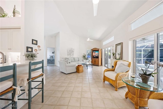 597 Lambton Ln, Naples, FL 34104 - living room with a ceiling fan, high vaulted ceiling, and light tile patterned floors