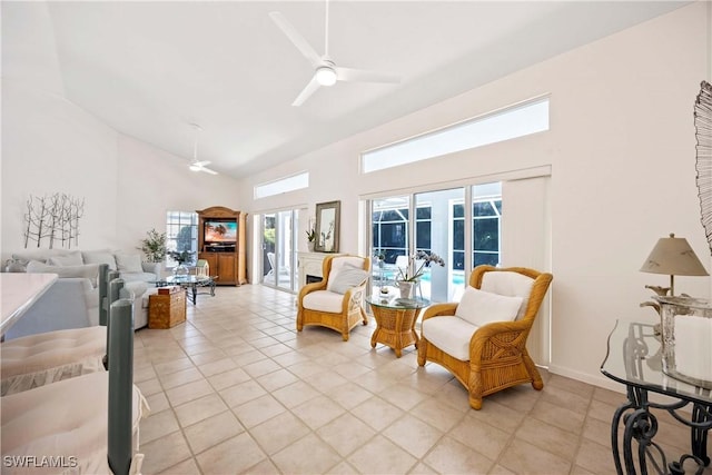 597 Lambton Ln, Naples, FL 34104 - living area featuring high vaulted ceiling, ceiling fan, a wealth of natural light, and light tile patterned flooring