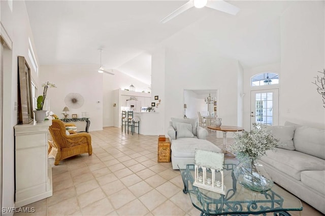 597 Lambton Ln, Naples, FL 34104 - living area with light tile patterned flooring, a ceiling fan, and high vaulted ceiling