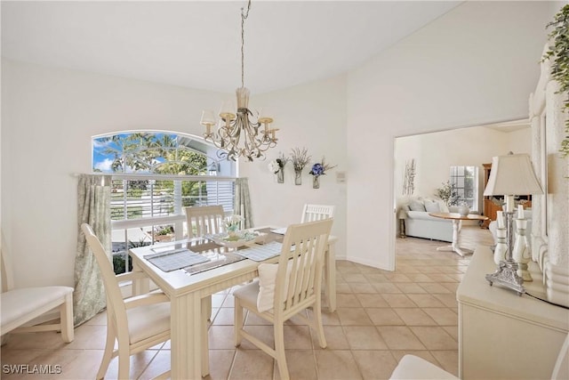597 Lambton Ln, Naples, FL 34104 - dining area with a wealth of natural light, a notable chandelier, light tile patterned flooring, and lofted ceiling