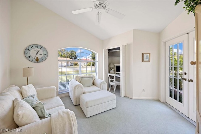 597 Lambton Ln, Naples, FL 34104 - living area featuring light colored carpet, lofted ceiling, a ceiling fan, and baseboards