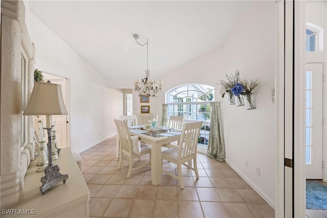 597 Lambton Ln, Naples, FL 34104 - dining area with lofted ceiling, a healthy amount of sunlight, and an inviting chandelier
