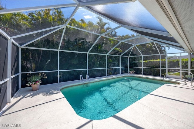 597 Lambton Ln, Naples, FL 34104 - pool featuring a patio area and glass enclosure