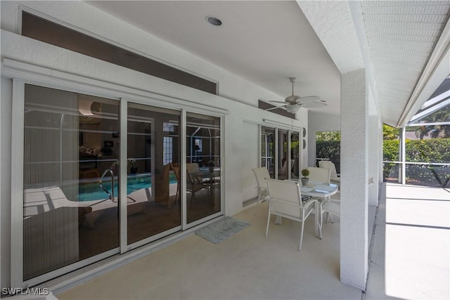 597 Lambton Ln, Naples, FL 34104 - view of patio / terrace featuring a lanai, an outdoor pool, and ceiling fan