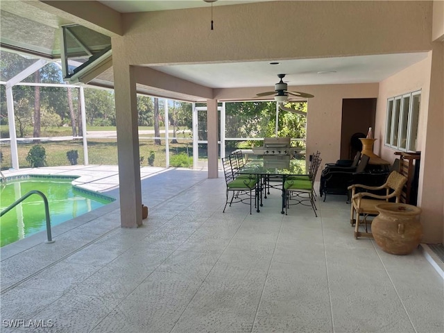 outdoor pool with ceiling fan, a lanai, a grill, and a patio