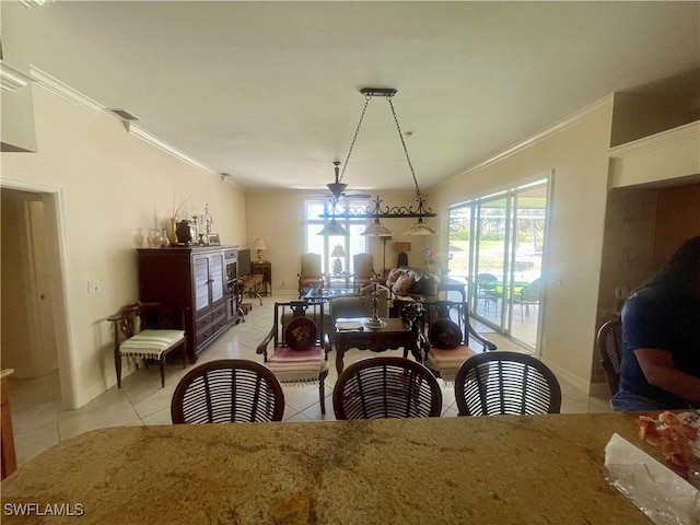 dining space featuring baseboards, crown molding, visible vents, and light tile patterned floors