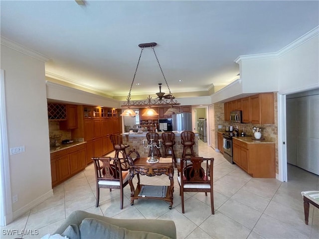 dining space featuring crown molding and light tile patterned floors