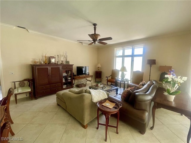 living room featuring light tile patterned floors, a ceiling fan, visible vents, and ornamental molding