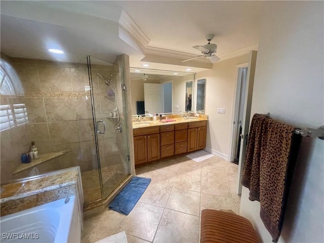 full bath with double vanity, a washtub, crown molding, and a stall shower
