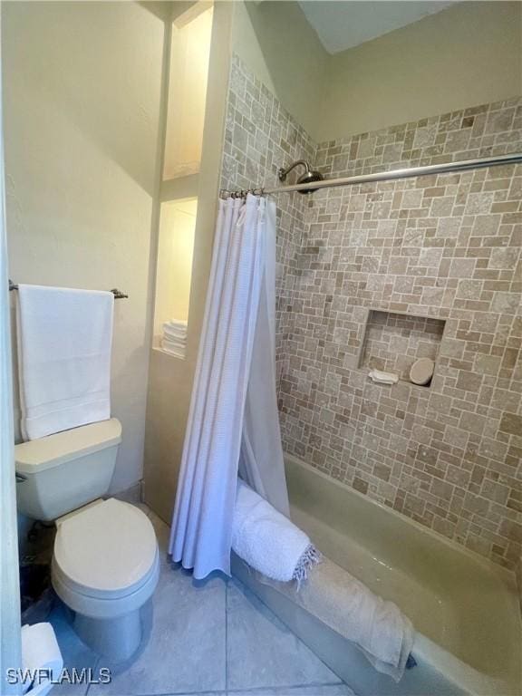 bathroom with shower / bath combination with curtain and toilet