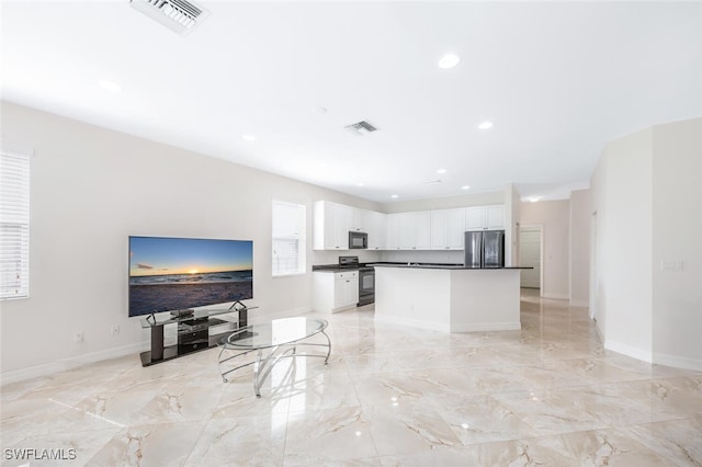 living area with visible vents, recessed lighting, and marble finish floor