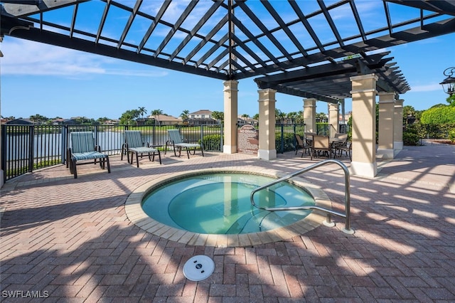 view of swimming pool with fence, a pergola, a community hot tub, outdoor dining area, and a patio