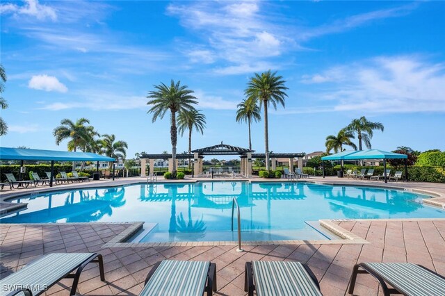 community pool featuring a pergola, a patio area, and a gazebo