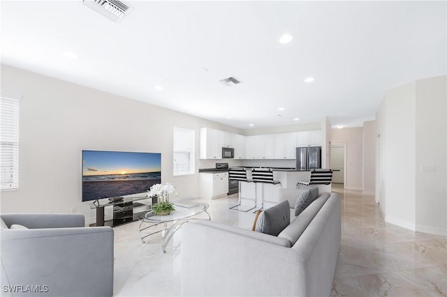 living room featuring recessed lighting, visible vents, marble finish floor, and baseboards