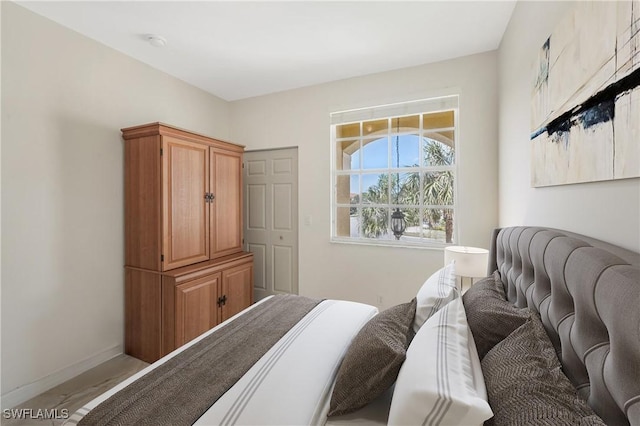 bedroom featuring baseboards